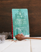 Load image into Gallery viewer, Drinking Chocolate Bag with a spoon of the drinking chocolate in the foreforont.
